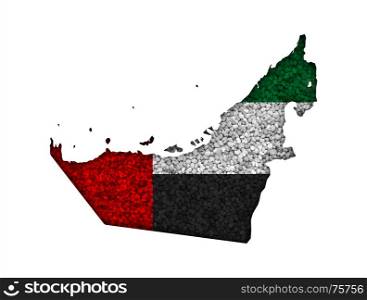 Map and flag of United Arab Emirates on poppy seeds