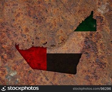 Map and flag of United Arab Emirates on rusty metal