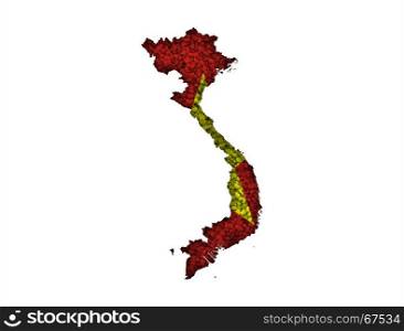 Map and flag of Vietnam on poppy seeds