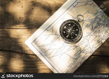 map compass with wooden background