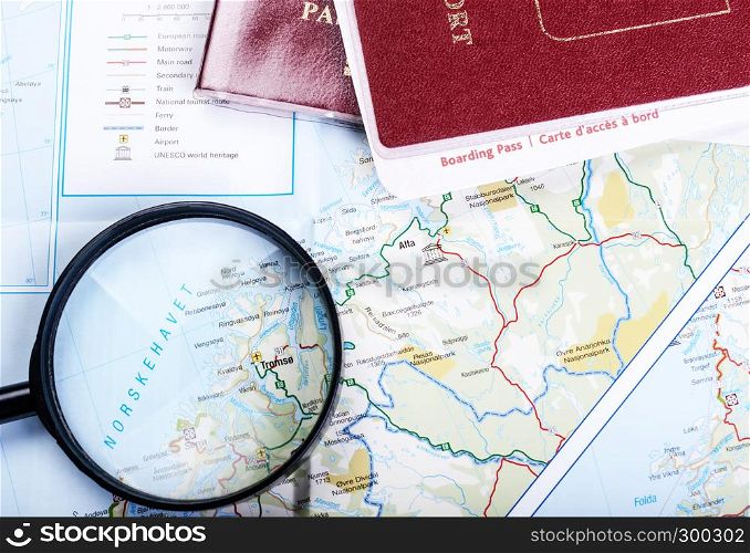 Map, magnifier and tablet. Map of fjords and magnifier and passport