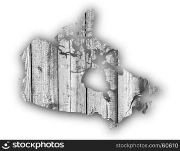 Map of Canada on weathered wood