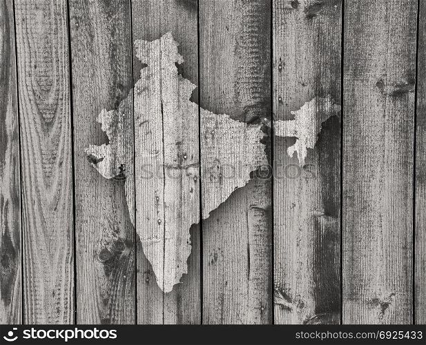 Map of India on weathered wood