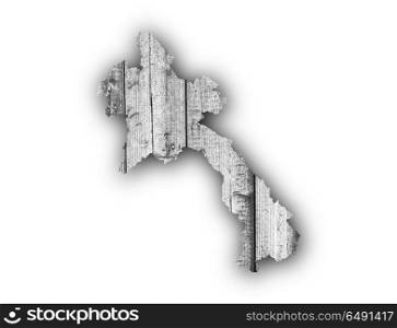 Map of Laos on weathered wood