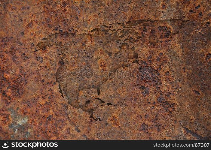 Map of North America on rusty metal