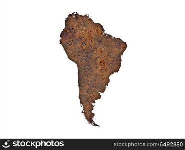 Map of South America on rusty metal