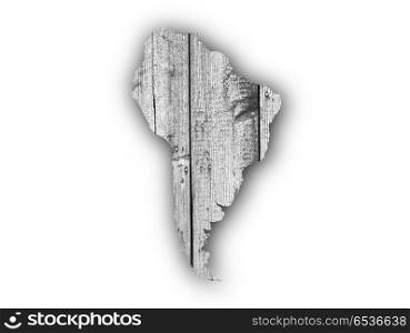 Map of South America on weathered wood