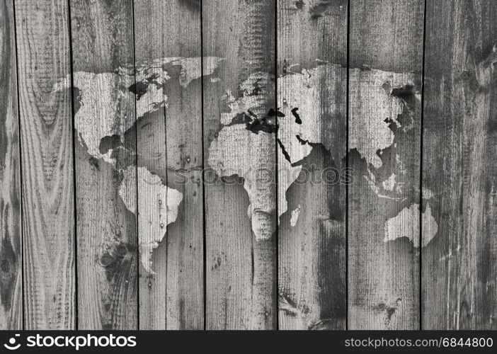 Map of the world on weathered wood