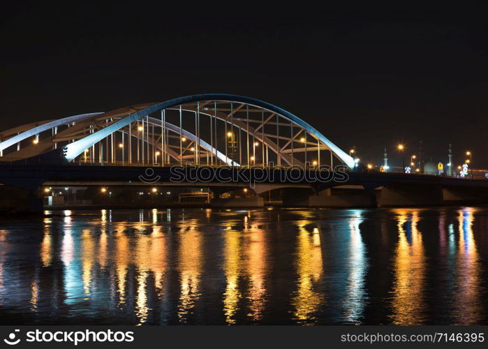 Maqta Bridge in Abu Dhabi, United Arab Emirates. Night view with water reflections