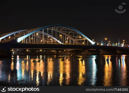 Maqta Bridge in Abu Dhabi, United Arab Emirates. Night view with water reflections