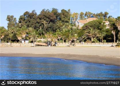 Marbella sandy beach by the sea summer holiday scenery in Spain, Andalusia region, Costa del Sol, Malaga province.
