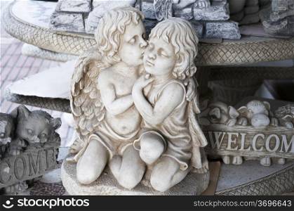 marble sculpture of two girls kissing