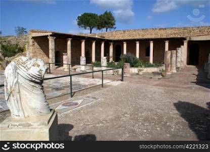 Marble statue and ruins of old roman villa in Carthage, Tunisia