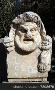 Marble theater mask in castle Bodrum, Turkey