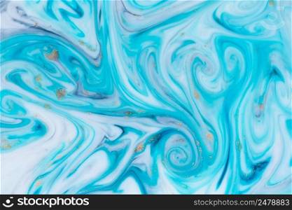 Marbled unique blue abstract background with gold dust. Flowing liquid marble texture.