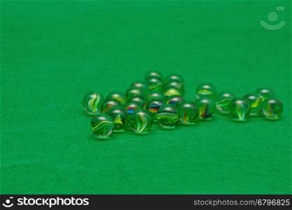 Marbles displayed on a green background