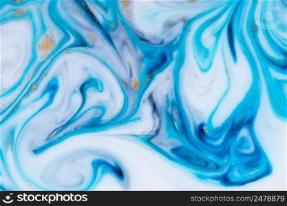Marbling unique blue abstract background with gold dust. Flowing liquid marble texture.