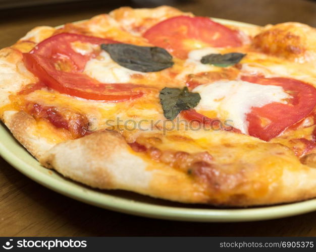 Margherita pizza with tomato, cheese and basil