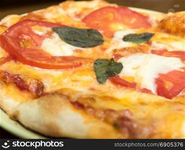 Margherita pizza with tomato, cheese and basil