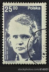 Maria Sklodowska Curie portrait on a vintage (1982), canceled post stamp from Poland