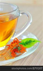 marigold herbal tea in glass cup