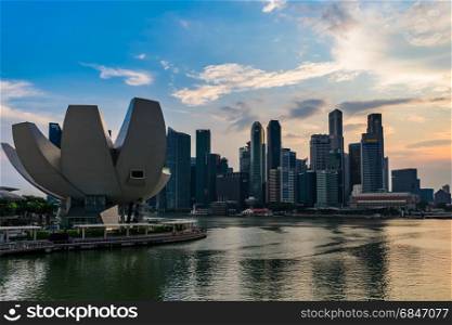 Marina Bay The Lotus Shaped ArtScience Museum with Cloudy Evenin. Singapore - March 25, 2017: Marina Bay The Lotus Shaped ArtScience Museum with Cloudy in Evening and Cityscape downtown area in the background.