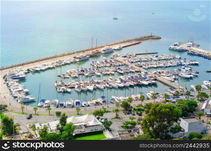 Marina with boats and yachts. View from above. Faces of people and trade marks are not visible. Sidi Bou Said, Tunisia. Marina with boats and yachts. View from above