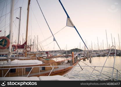 Marina with docked yachts at sunset in Turkey