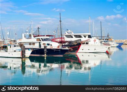 Marina with yachts and motorboats in bright sunlight, Larnaca, Cyprus