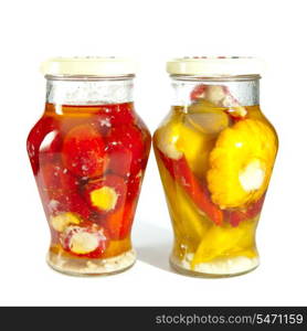 Marinaded tomatoes, stuffed and bush pumpkins and vegetable marrows in a glass jar