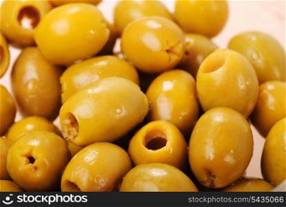 Marinated green olives close up