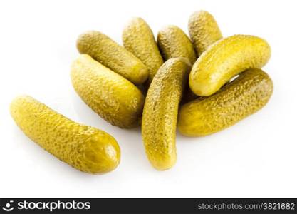marinated pickled cucumbers isolated on white.