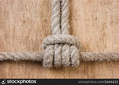 Marine knot on a wooden background