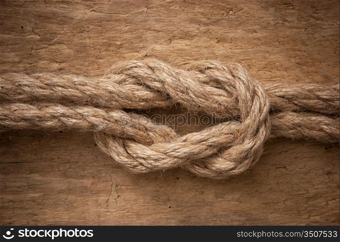 Marine knot on a wooden background
