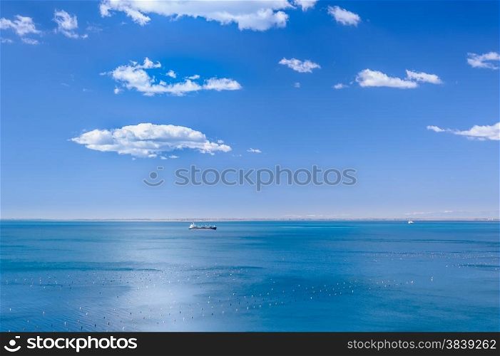 Marine scene with the ship and clouds