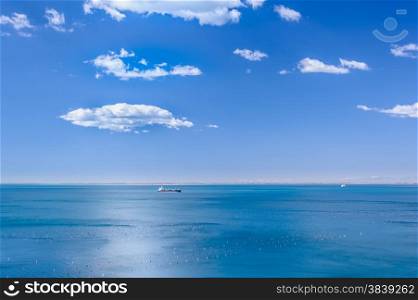 Marine scene with the ship and clouds