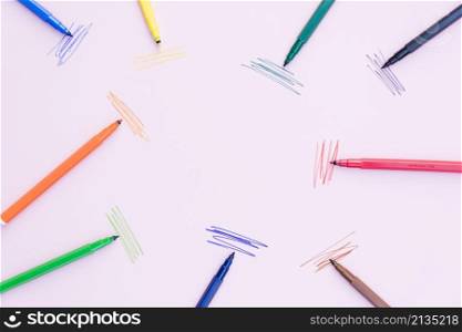 marker pens lying near strokes
