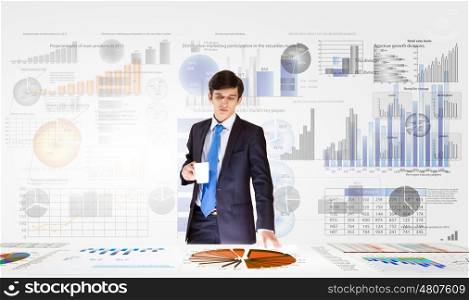 Market business. Young businessman and statistics information at background