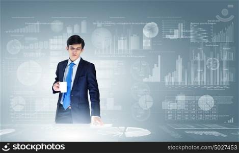 Market business. Young businessman and statistics information at background