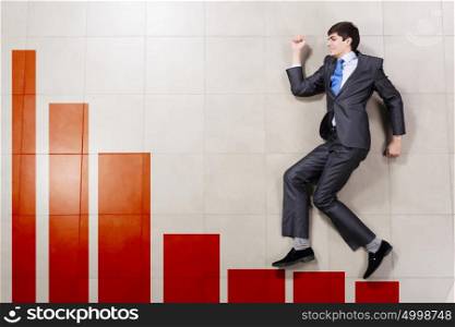 Market growth. Young businessman running on increasing graph. Growth concept