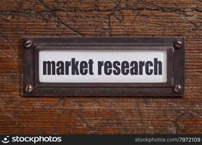 market research - a label on a grunge wooden file cabinet