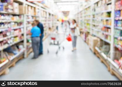 Market shop and supermarket interior with customers as blurred store background