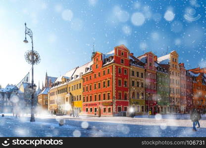 Market Square in Wroclaw, Poland. Multicolored traditional historical houses on Market square in the winter snowy morning, Old Town of Wroclaw, Poland