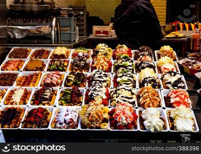 Market with colorful sweets and cookies. Pastry shop with beautifuly decorated cakes and cookies.. Market with colorful sweets and cookies. Pastry shop with beautifuly decorated cakes and cookies