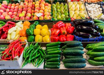 market with various colorful fresh fruits and vegetables. Farmers market. Fresh vegetables on shelf in supermarket