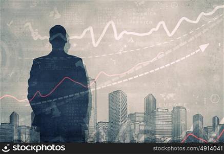 Marketing concept. Silhouette of businessman standing with back and infographs at background