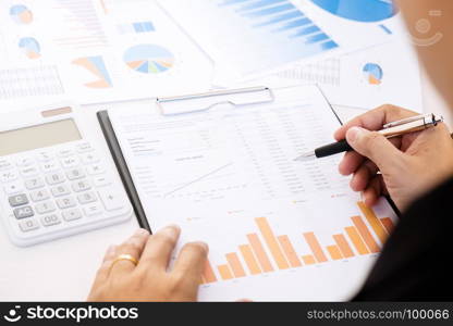 marketing performance analyst working with sale report on a office desk