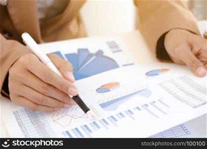 marketing performance analyst working with sale report on a office desk