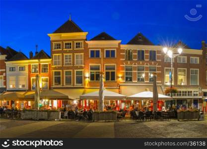 Markt square with typical Dutch houses in the center of the old city at night, Delft, Holland, Netherlands