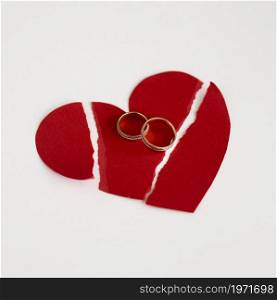 marriage rings paper heart broken. High resolution photo. marriage rings paper heart broken. High quality photo